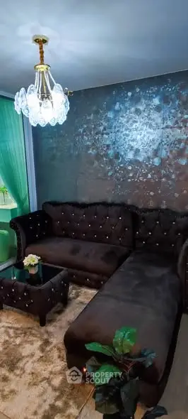 Luxurious living room with plush velvet sofa and elegant chandelier