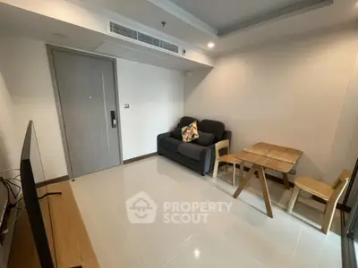 Modern living room with sleek furniture and minimalist design in a cozy apartment.