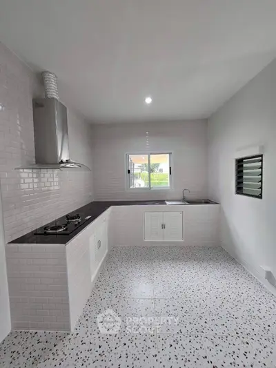 Modern kitchen with sleek gas stove and minimalist design