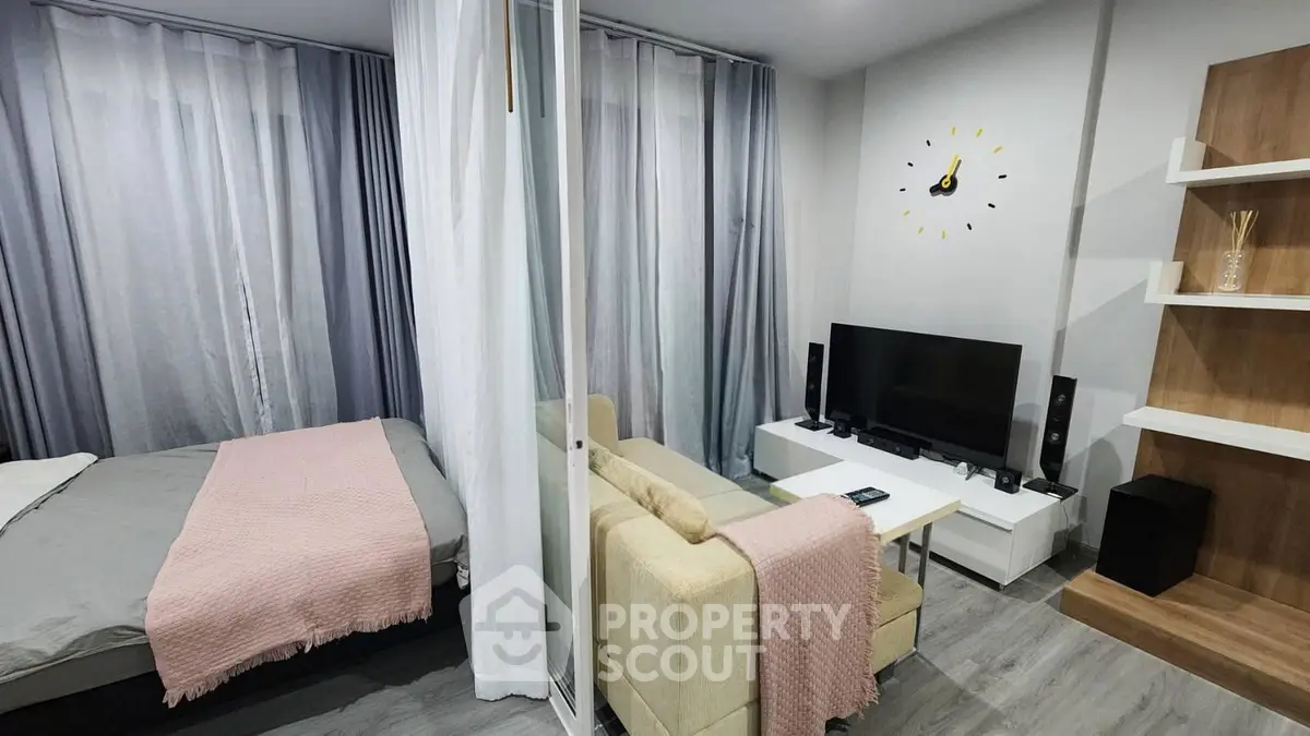 Modern studio apartment with cozy living area and stylish decor