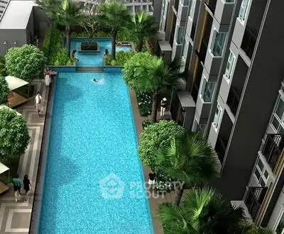 Luxurious apartment complex with stunning pool and lush greenery