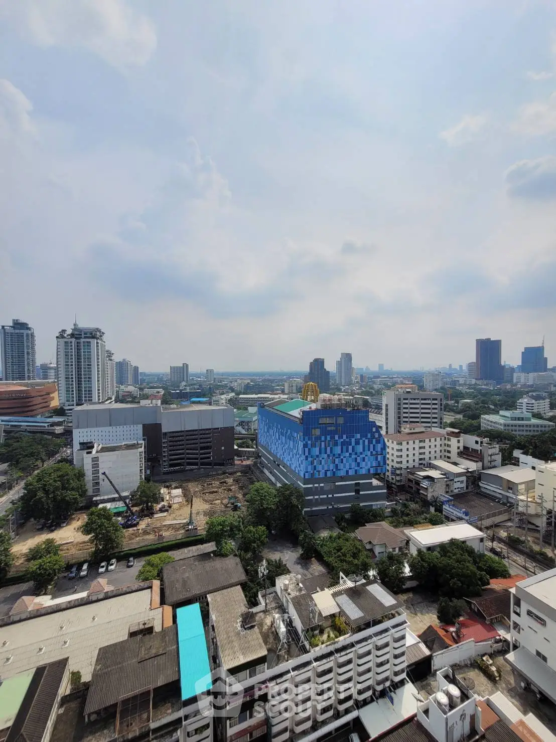 Stunning cityscape view from high-rise building showcasing urban skyline and vibrant architecture.