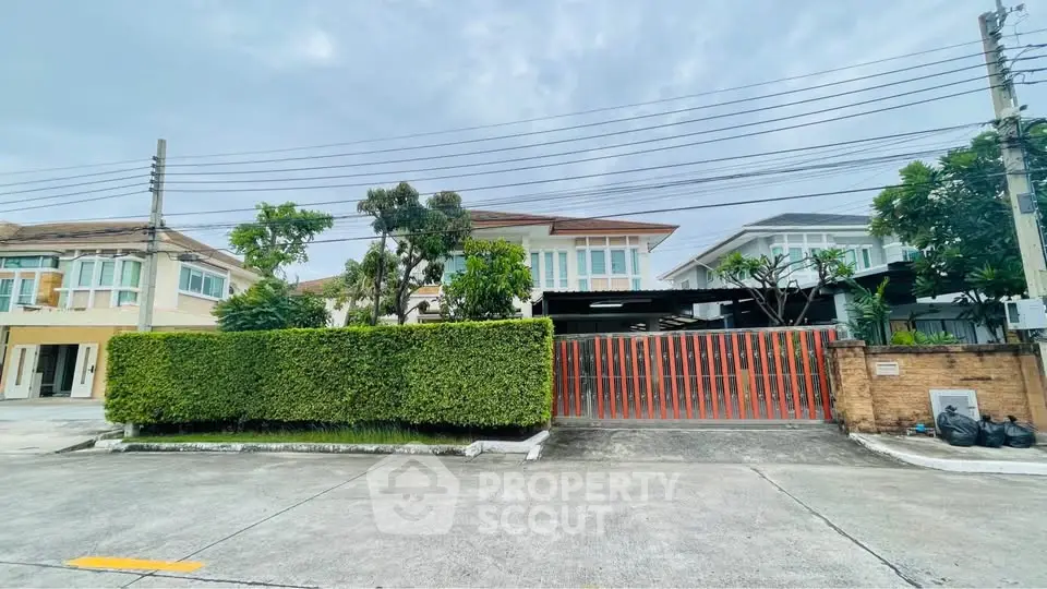 Charming suburban house with lush greenery and modern architecture, perfect for family living.