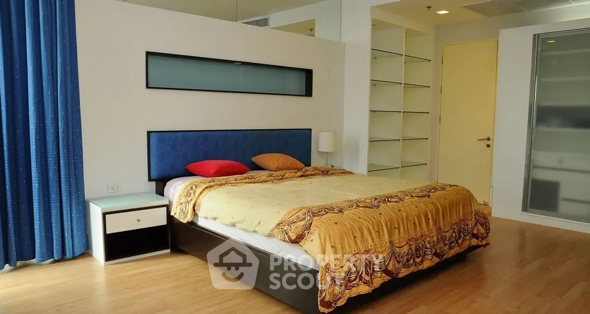 Spacious bedroom with modern design and ample natural light