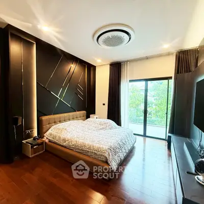 Luxurious bedroom with modern design and balcony view