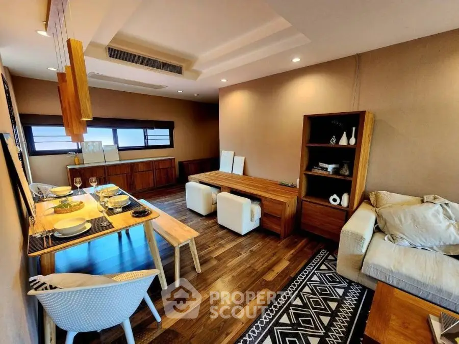 Modern living room with stylish wooden furniture and cozy seating area