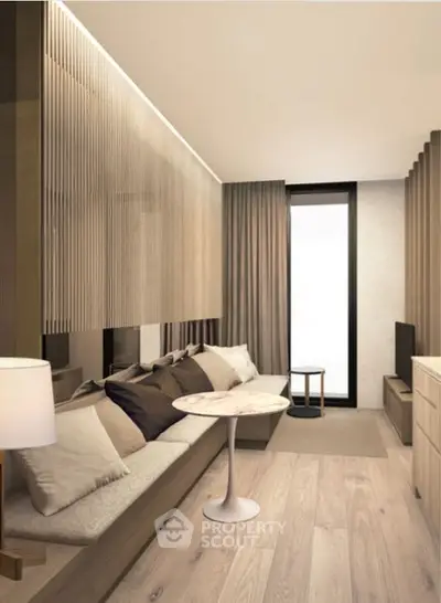 Modern living room with sleek design, featuring a cozy sofa, stylish table, and elegant decor.