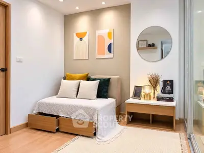 Stylish modern living room with cozy sofa, elegant decor, and warm lighting in a contemporary apartment.