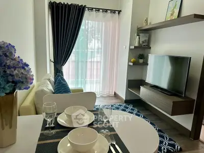 Modern living room with stylish decor and natural light, featuring a cozy seating area and elegant dining setup.