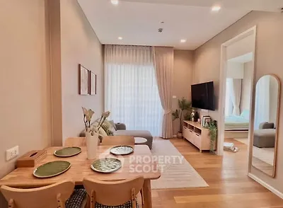 Stylish modern living room with dining area and natural light