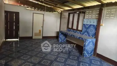 Rustic kitchen with blue patterned tiles and open layout design.