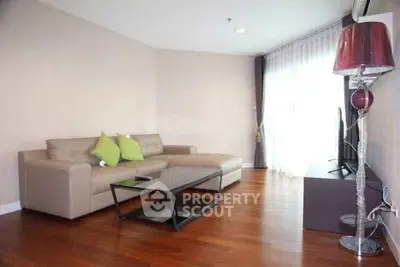 Modern living room with sleek furniture and wooden flooring
