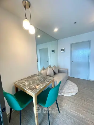 Modern living room with stylish furniture and elegant lighting in a cozy apartment.