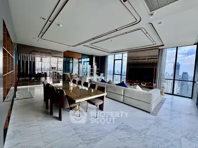 Luxurious open-plan living room with stunning city views and elegant modern decor.