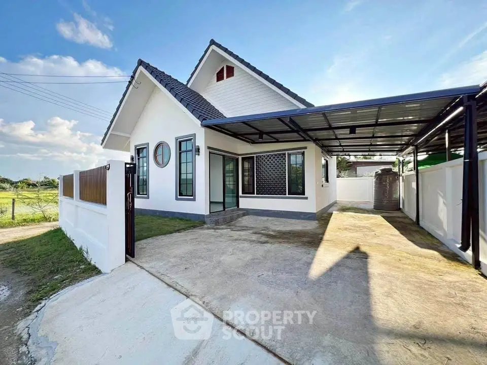Charming single-story house with spacious driveway and modern design.