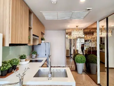 Luxurious modern kitchen with sleek cabinetry and elegant lighting, perfect for culinary enthusiasts.