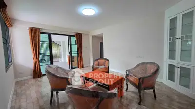 Spacious living room with elegant furniture and large windows for natural light.