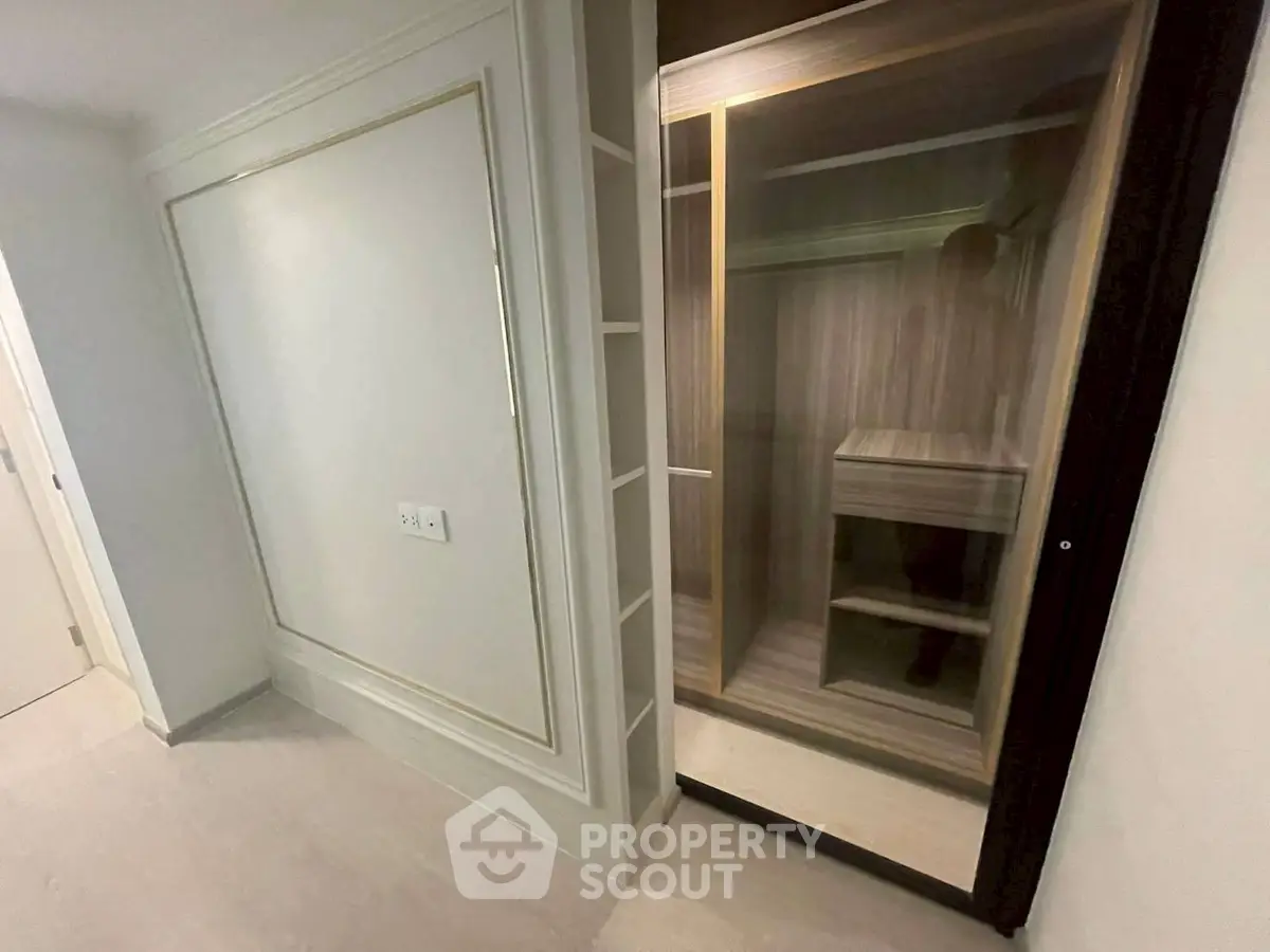 Spacious walk-in closet with elegant wood finish and ample storage space