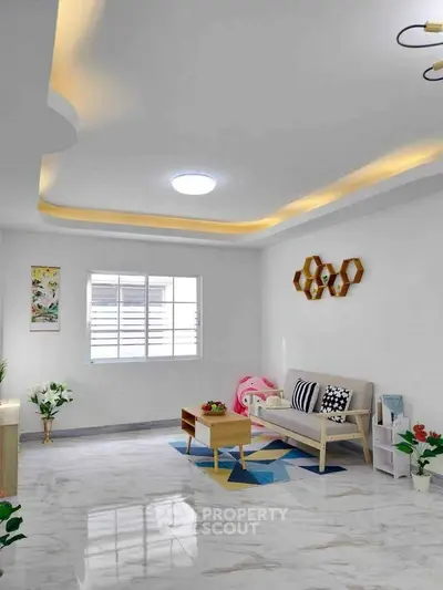 Modern living room with stylish ceiling lights and cozy decor