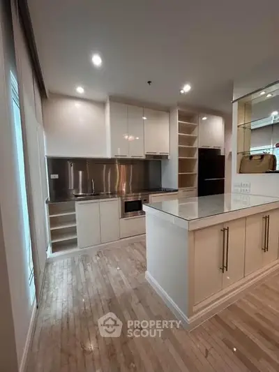 Modern kitchen with sleek cabinetry and stainless steel appliances