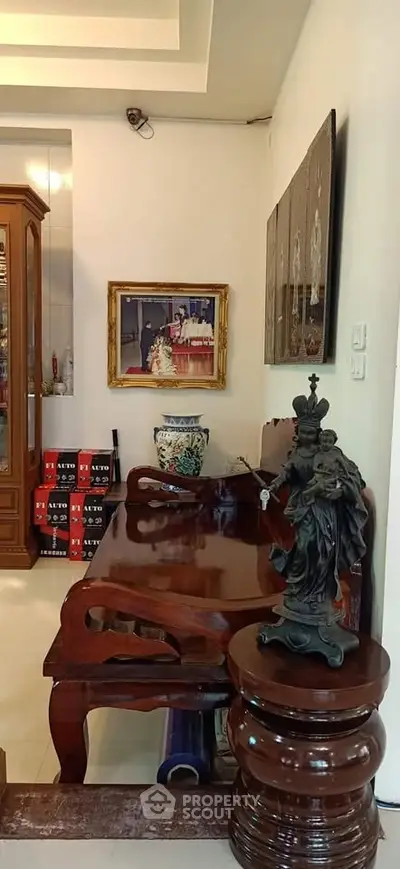 Elegant living room with classic wooden furniture and decorative art pieces