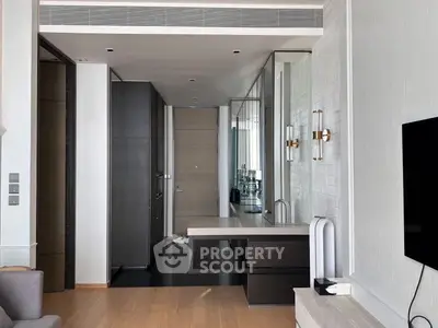 Modern interior with sleek design and open layout, featuring a stylish kitchen and living area.