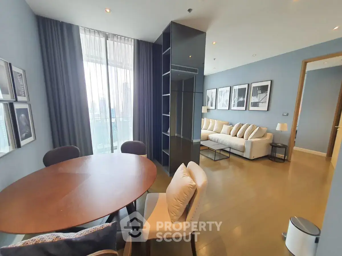 Spacious modern living room with elegant dining area and large windows