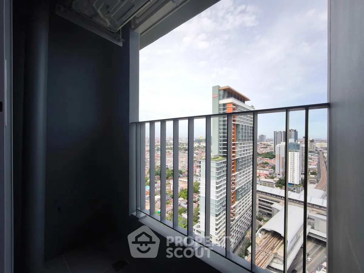 Stunning high-rise balcony view overlooking cityscape and modern architecture, perfect for urban living.