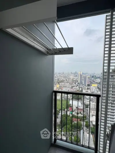 Stunning high-rise balcony with panoramic city view, perfect for urban living.