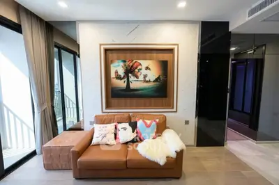 Stylish living room with modern decor and large windows for natural light