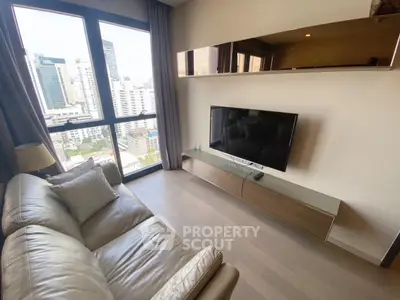 Modern living room with city view and sleek TV setup