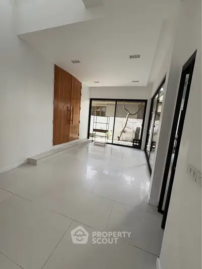 Spacious modern living room with large windows and sleek design