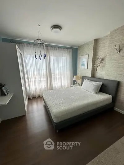 Modern bedroom with large window and stylish decor