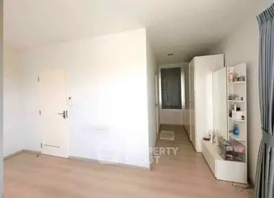 Spacious minimalist bedroom with ample storage and natural light