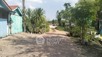 Charming rural property with lush greenery and spacious outdoor area, perfect for nature lovers seeking tranquility.