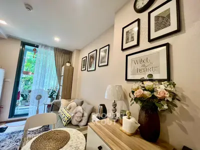 Charming living room with cozy decor and balcony view
