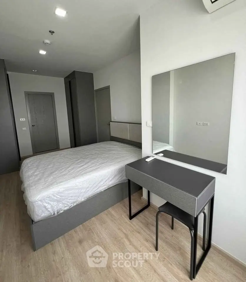 Modern minimalist bedroom with sleek furniture and neutral tones, perfect for a serene living experience.