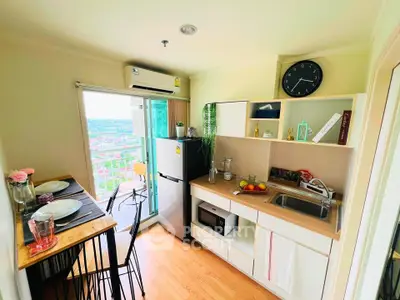 Charming kitchen with open layout and balcony view, featuring modern appliances and stylish decor.