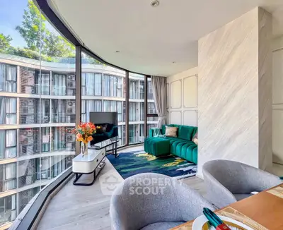 Stunning modern living room with floor-to-ceiling windows and stylish decor in a luxury apartment.