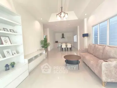 Spacious modern living room with elegant decor and open layout, perfect for family gatherings.