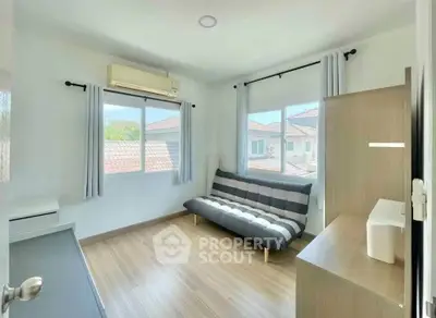 Bright and airy living room with modern decor and large windows in a cozy home.