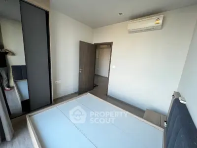 Spacious bedroom with modern design and built-in wardrobe