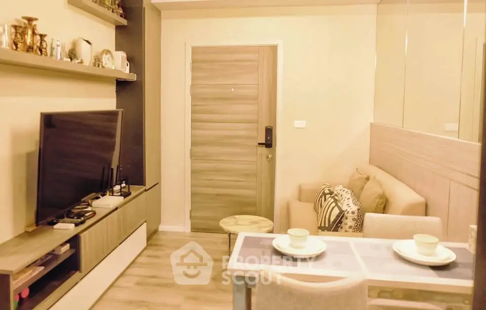 Cozy living room with modern decor and dining area, perfect for urban living.