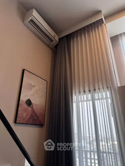 Modern interior with air conditioning and elegant curtains in a stylish living space.