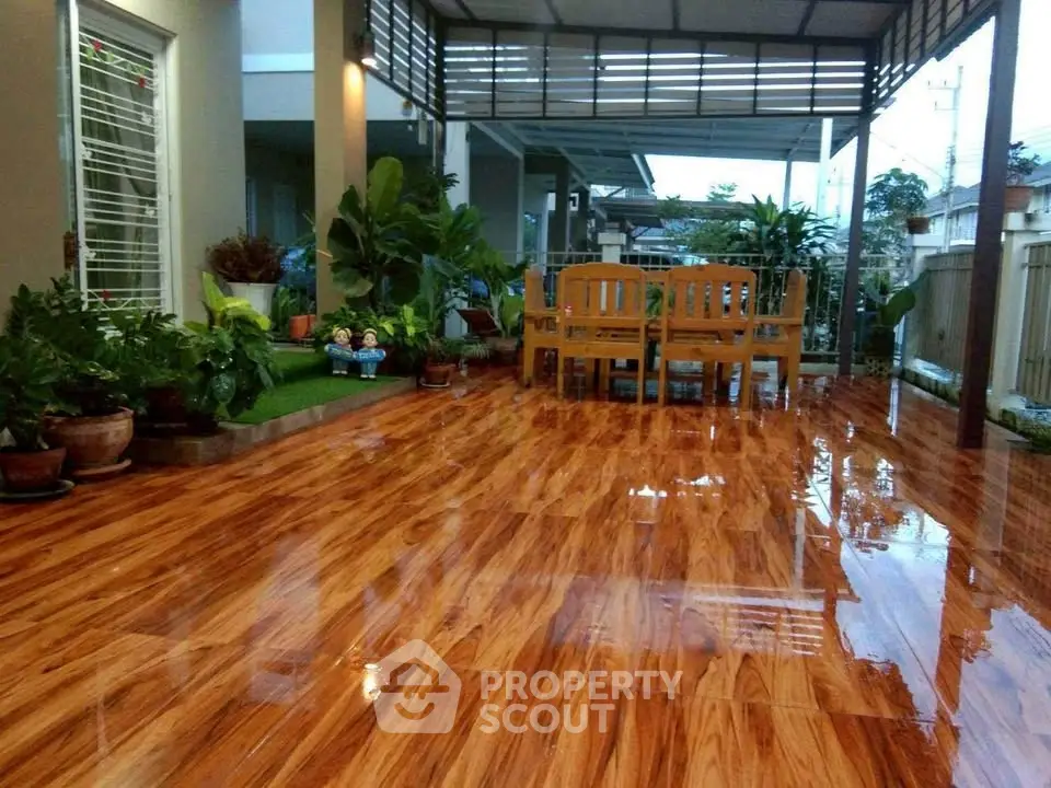 Stunning polished patio with lush greenery and elegant outdoor seating area.
