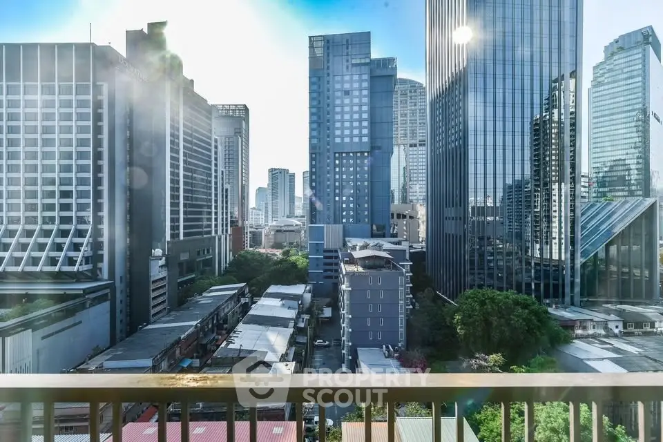 Stunning cityscape view from a high-rise balcony showcasing modern skyscrapers and urban skyline.