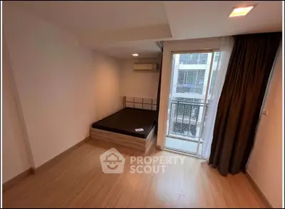 Modern bedroom with balcony access in a stylish apartment
