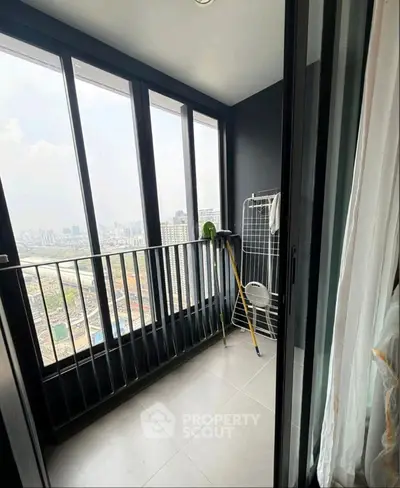 Spacious balcony with stunning city view and modern railing design.