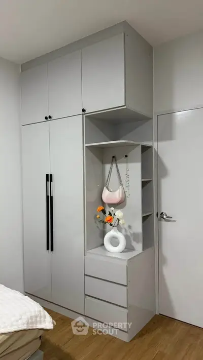 Modern bedroom with sleek built-in wardrobe and stylish decor