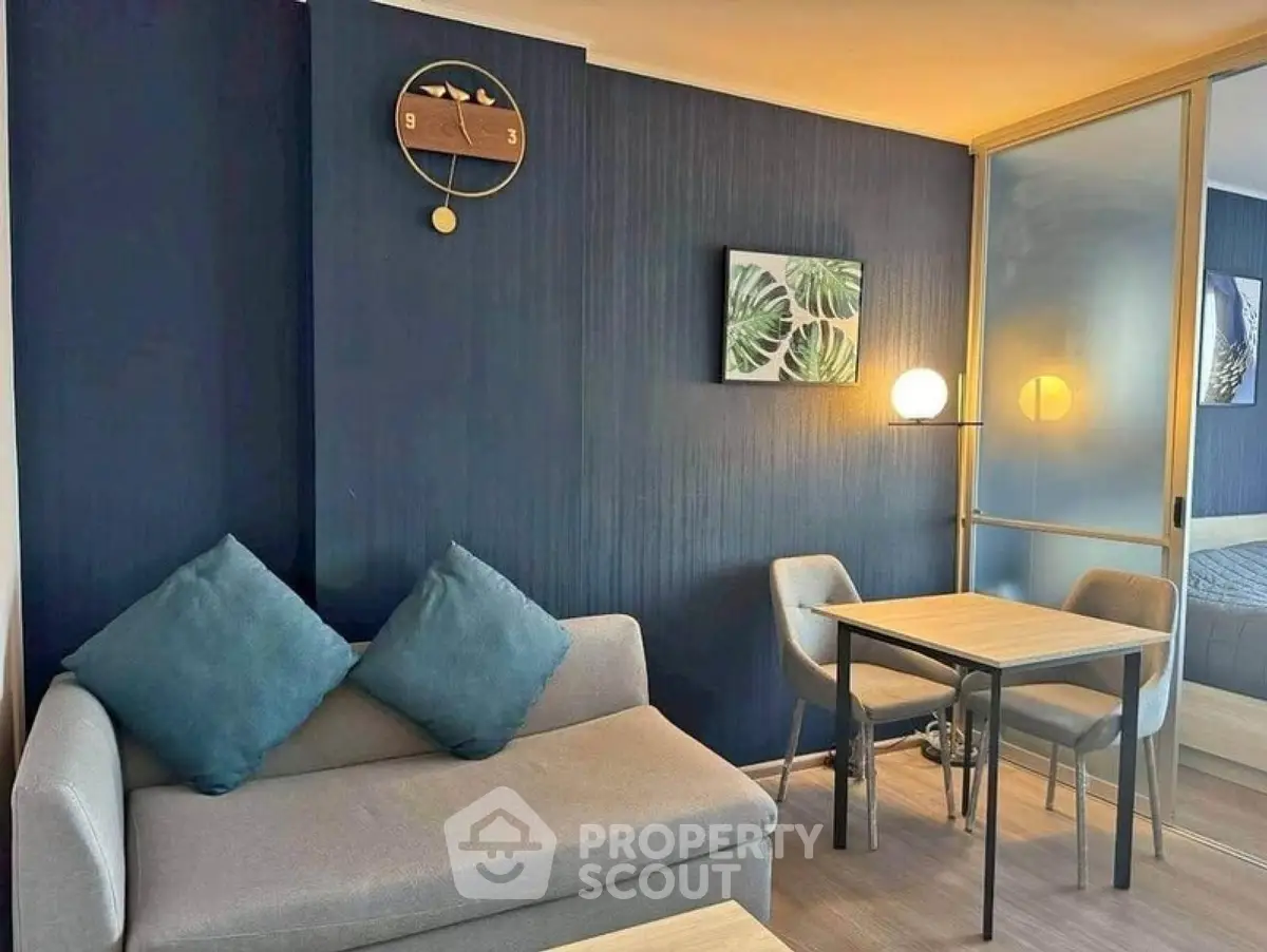 Modern living room with stylish decor and cozy seating area in a contemporary apartment.